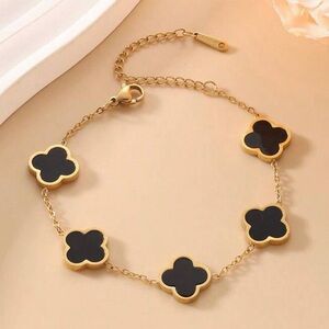 Elegant Gold and Black Clover Bracelet